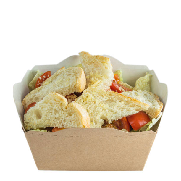 istock Salad to go in paper box, isolated on white 1188925586