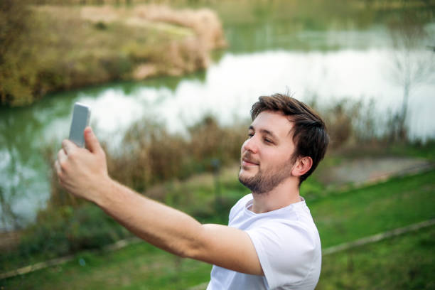 istock people on modern technologhy selfie and relaxing in nature 1188927351