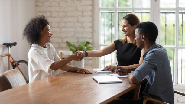 istock Happy mixed race young hr managers shaking hands with applicant. 1188929898