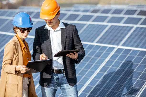 istock Business people on a solar power station 1188930361