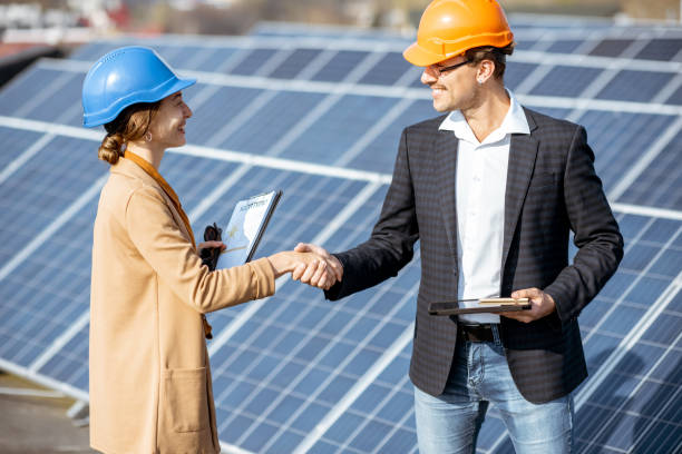 istock Business people on a solar power station 1188930404