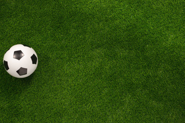 istock Soccer ball on the green field. View from above. flat lay.Copy space. 1188932121