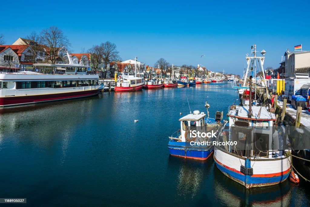 Fishing boats in winter time in Warnemuende, Germany Fishing boats in winter time in Warnemuende, Germany. Architecture Stock Photo
