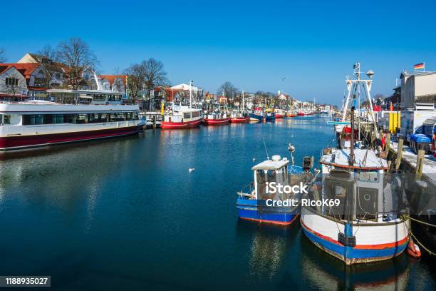 Fishing Boats In Winter Time In Warnemuende Germany Stock Photo - Download Image Now