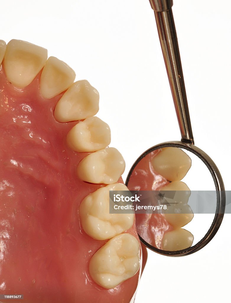 Teeth examined by dental mirror during checkup  Angled Mirror Stock Photo