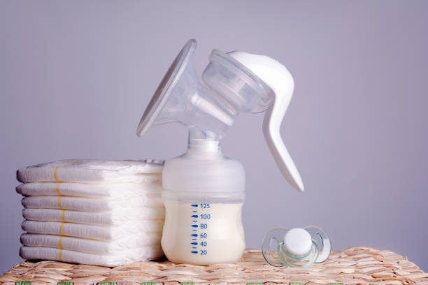 istock breast pump, diapers and baby pacifier 1188936831