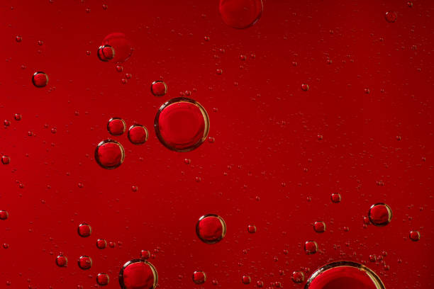 istock drops of oil on a red background 1188938309