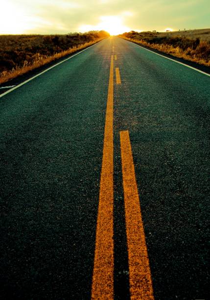 istock Calm road going to sunny sunset 1188939252