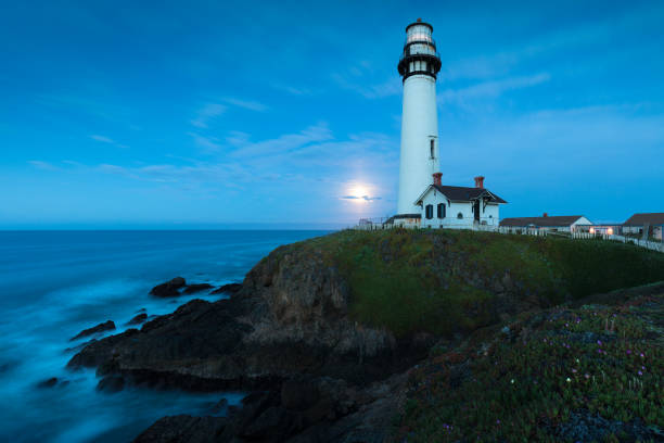 istock White pigeon point lighthouse with a blue sky  Historic Old Lighthouse at sunset - Pigeon Point Lighthouse - California, USA 1188939555