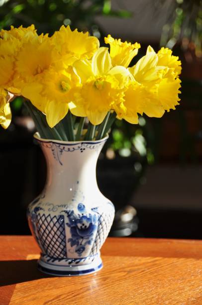 istock Daffodils standing in a vase with water 1188939742