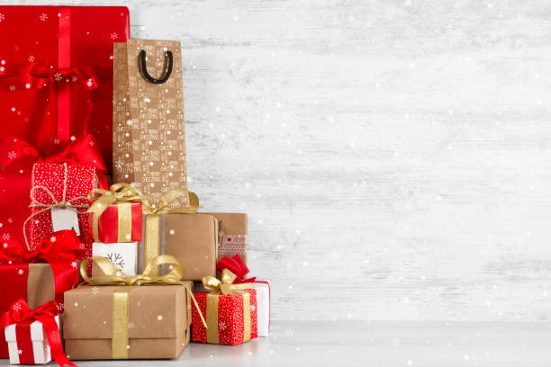 istock Christmas Gift Boxes on Frozen Wooden Table 1188940260