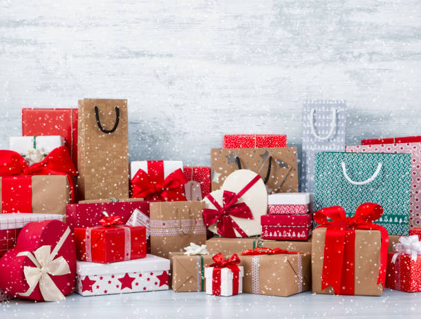 istock Christmas Gift Boxes on Frozen Wooden Table 1188940577