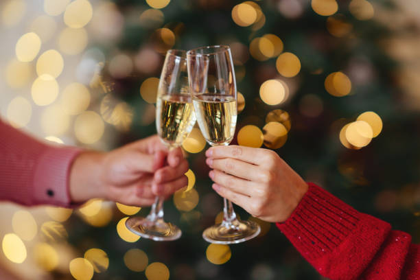 istock hands with full champagne glasses 1188942245