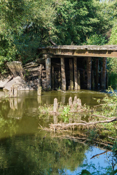 istock Old dilapidated wooden bridge over the river. 1188946046