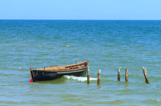 Fishing boat anchored in the blue sea