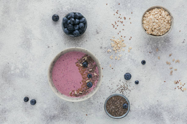 istock Ingredients for making pink yogurt smoothie bowl with blueberry and seeds 1188950814