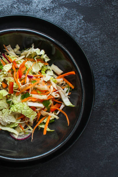 istock vegetable salad (Chinese cabbage, carrot, onion, lettuce, mix salad) menu concept. food background. top view. copy space 1188951838