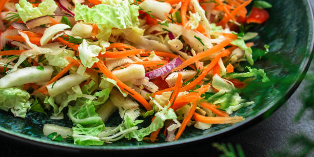 istock vegetable salad (Chinese cabbage, carrot, onion, lettuce, mix salad) menu concept. food background. top view. copy space 1188951929