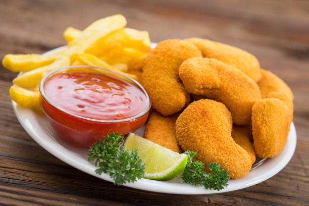 Chicken nuggets with ketchup on the plate