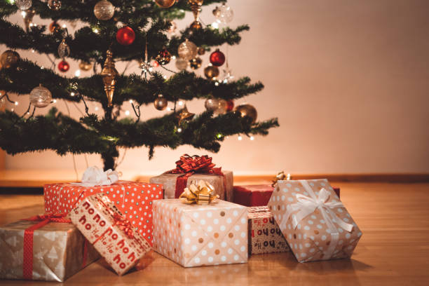 istock A pile of decorative Christmas presents under the Christmas tree 1188954204