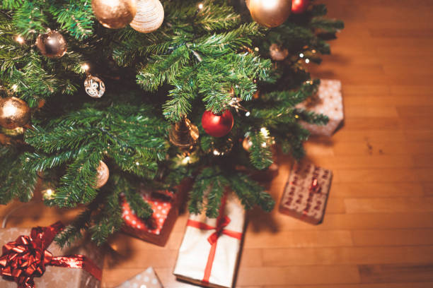 istock Festive Christmas tree and Christmas presents underneath 1188954213