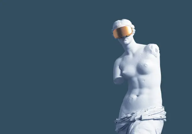 Photo of 3D Model Aphrodite With Golden VR Glasses On Blue Background. Virtual Art Concept.