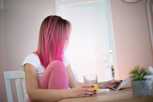 istock Woman having breakfast in pajamas 1188954562