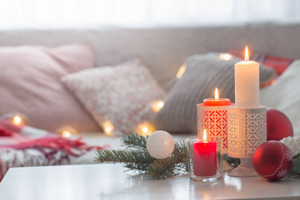 istock Christmas decora with candles and balls on white table indoor 1188956059