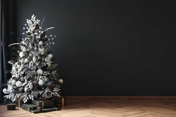 Photo of Christmas tree in black room interior