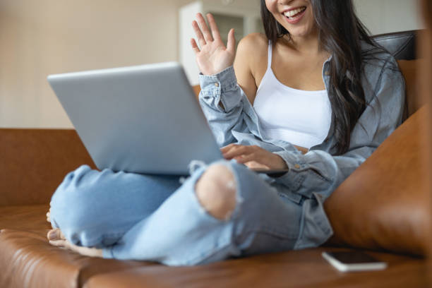 istock Smiling young female communicating over the net 1188961613