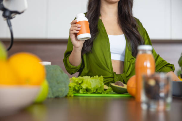 istock Stylish young woman standing in the kitchen 1188961837