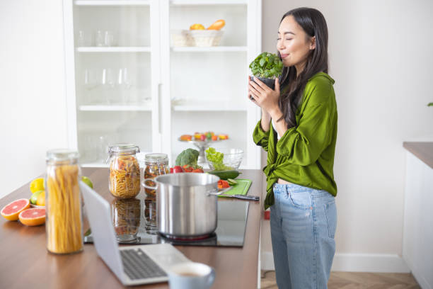 istock Blissful cook with eyes closed standing indoors 1188961972