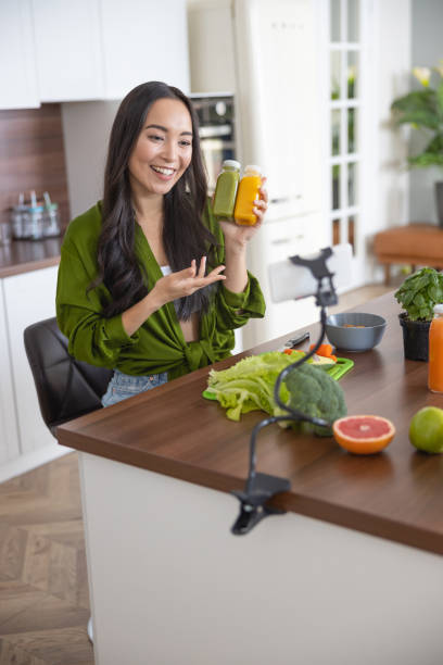 istock Young video blogger talking to her followers 1188962123