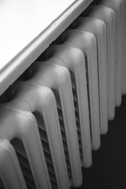 istock Old iron radiator closeup, central heating in the room. 1188964985