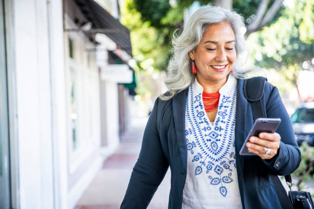 istock Mexican Businesswoman Texting 1188965822