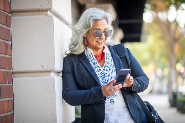 istock Mexican Businesswoman Texting 1188966103