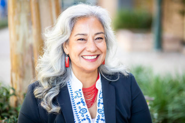 Portrait of a Happy Mexican Businesswoman A mature Mexican businesswoman smiling white hair photos stock pictures, royalty-free photos & images