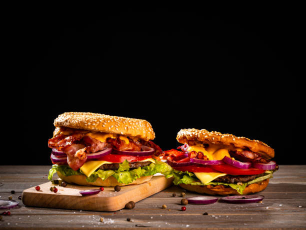 istock Bacon burger with beef patty on wooden table 1188967841