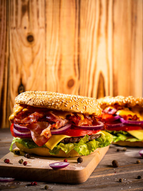 istock Bacon burger with beef patty on wooden table 1188968226
