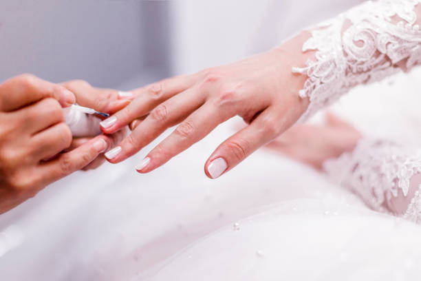 nail polish bride's hand stock photo