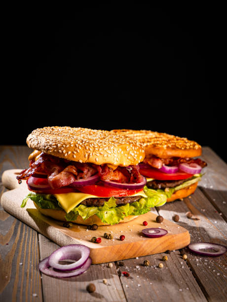 istock Bacon burger with beef patty on wooden table 1188968812