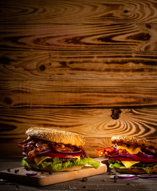 istock Bacon burger with beef patty on wooden table 1188969007