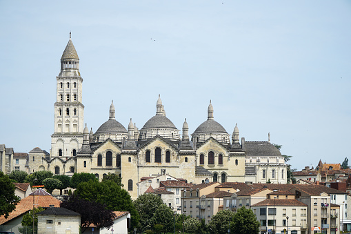 cathedral with tower and three domes in city skyline of Perigieux, Dordogne, France