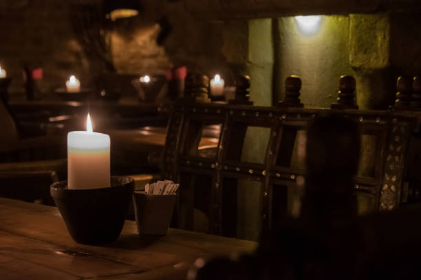 istock Big candle in a plate on a wooden table 1188970955