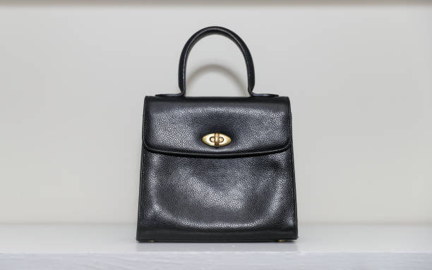 istock Black hand bag closeup. Designer handbag 1188972257