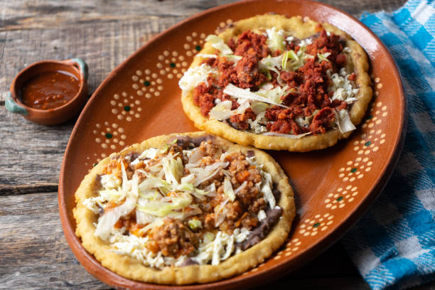 istock Mexican food: sopes of Chorizo and beef picadillo with cheese and beans 1188973825