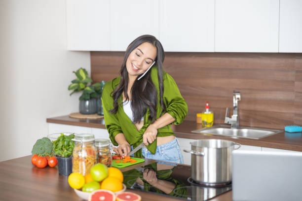 istock Busy young housewife making a phone call 1188976137