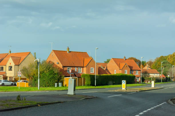 istock English Traditional Houses on Blurred Sky Background 1188977708