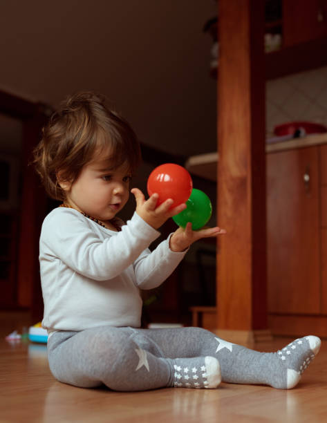 istock Playing with two toys indoors 1188978709