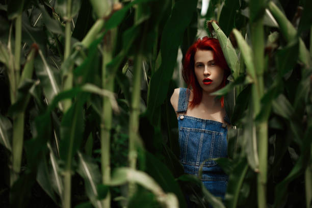 istock Redhead woman in the cornfield 1188979037